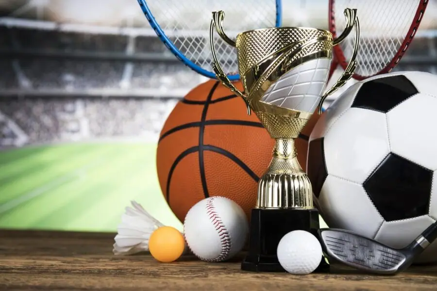 Trophy with balls from many sports, including basketball, soccer and golf