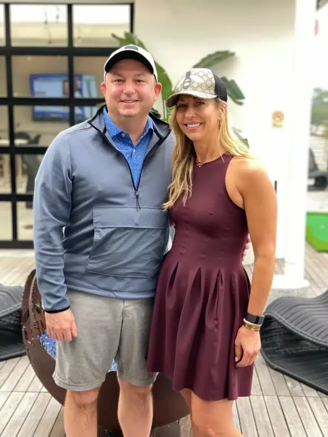 A happy couple smiling for a picture together