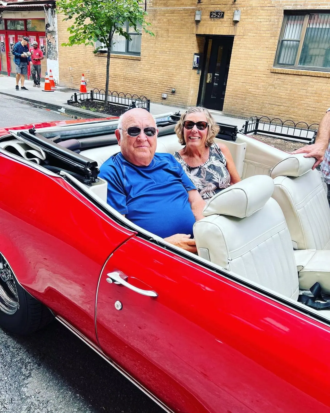 MAC Sports Travel guests ride in a red convertible in New York
