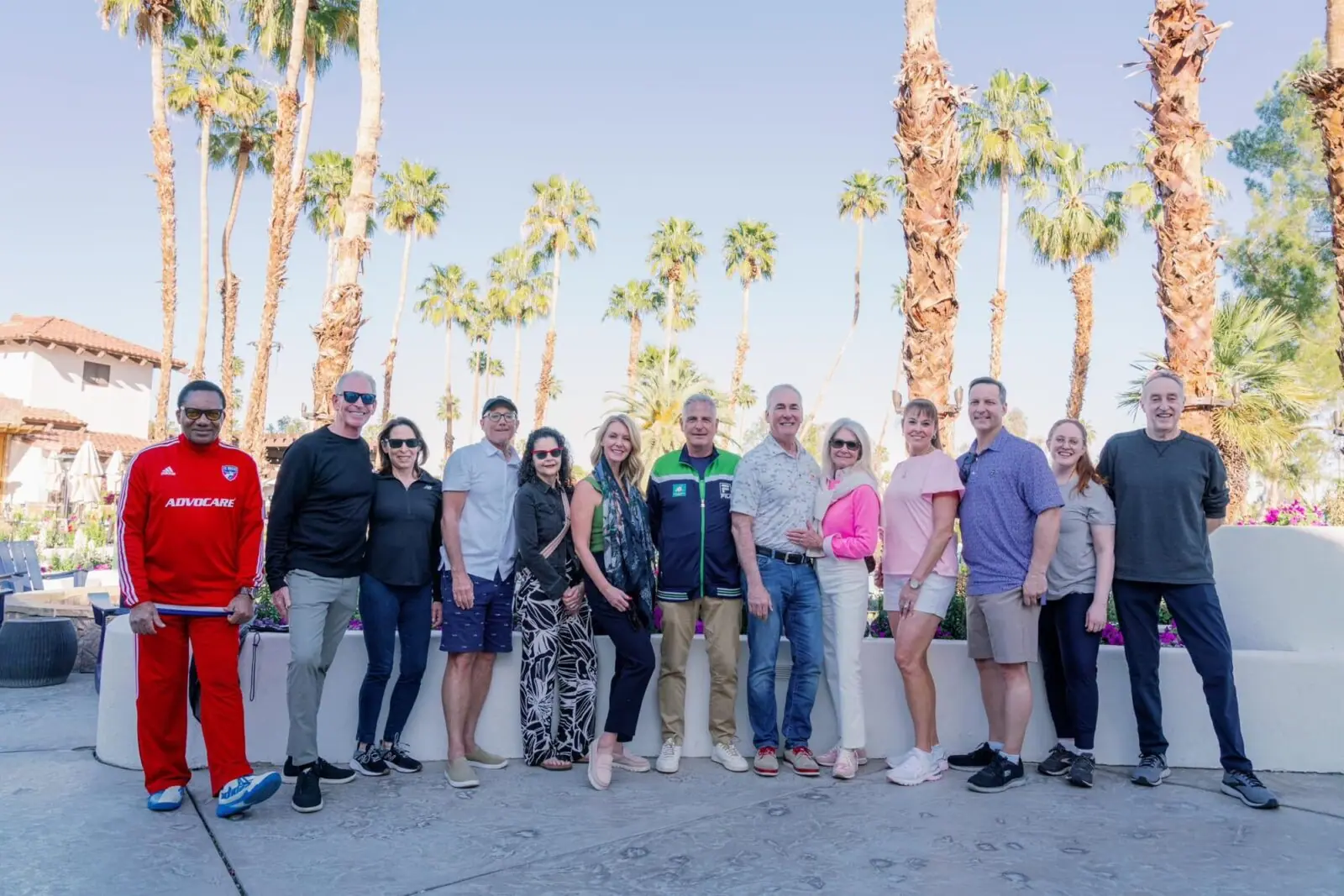 MAC Sports Travel group at a palm-lined desert resort near Indian Wells